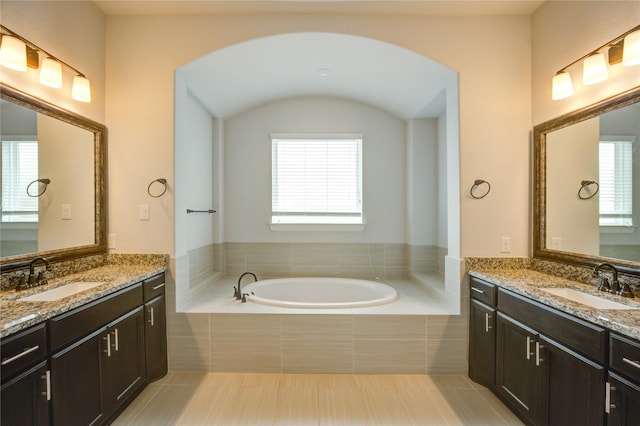 3242 N Upland St, Katy, TX 77493 - bathroom featuring tile patterned floors, two vanities, a garden tub, and plenty of natural light