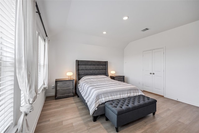 24107 Avocet Creek Rd, Katy, TX 77493 - bedroom with light wood-style flooring, vaulted ceiling, recessed lighting, and a closet