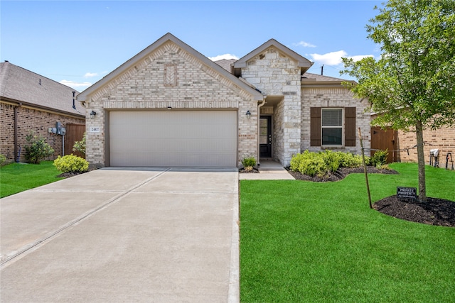 24107 Avocet Creek Rd, Katy, TX 77493 - french country style house with a garage, concrete driveway, and stone siding