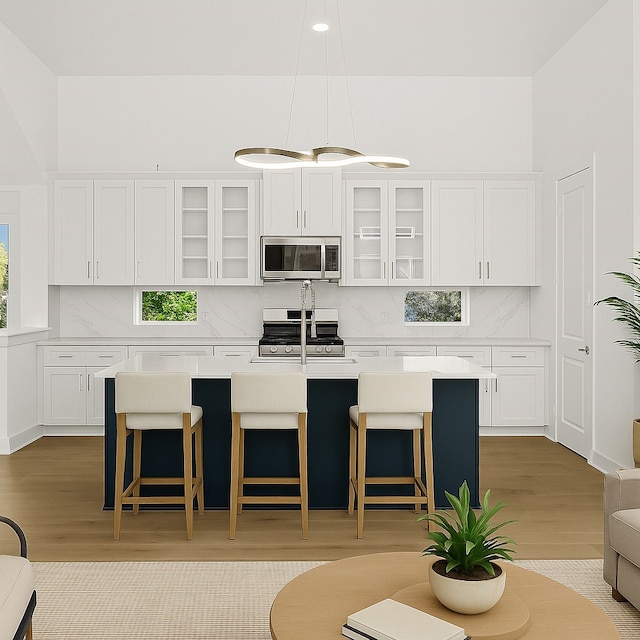 2122 Oatfield Dr, Houston, TX 77018 - kitchen featuring appliances with stainless steel finishes, light wood-style flooring, backsplash, and recessed lighting