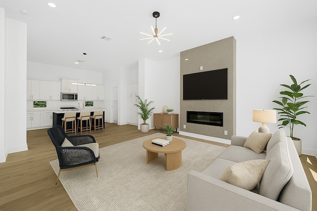 2122 Oatfield Dr, Houston, TX 77018 - living area with light wood-style floors, recessed lighting, and a fireplace