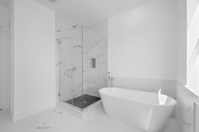 2122 Oatfield Dr, Houston, TX 77018 - bathroom with marble finish flooring, a soaking tub, and a marble finish shower