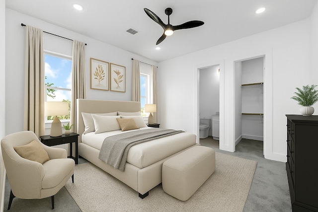 2122 Oatfield Dr, Houston, TX 77018 - bedroom with a walk in closet, multiple windows, ensuite bathroom, recessed lighting, and carpet