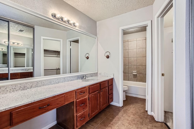 11910 Yearling Dr, Houston, TX 77065 - bathroom with a textured ceiling, vanity, tile patterned floors, and washtub / shower combination
