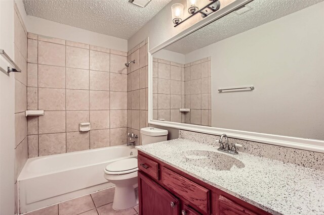 11910 Yearling Dr, Houston, TX 77065 - bathroom featuring vanity, tile patterned floors, a textured ceiling, and  shower combination