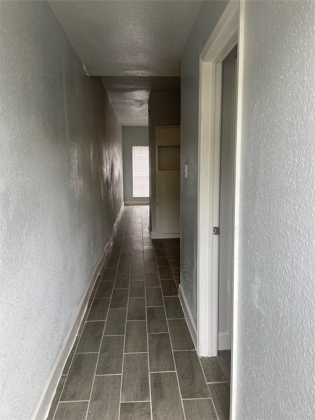 8703 Victorian Village Dr Unit 8703, Houston, TX 77071 - corridor with a textured ceiling and a textured wall