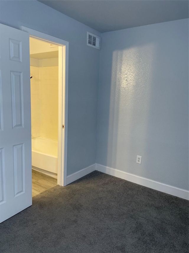 8703 Victorian Village Dr Unit 8703, Houston, TX 77071 - spare room with dark colored carpet and baseboards