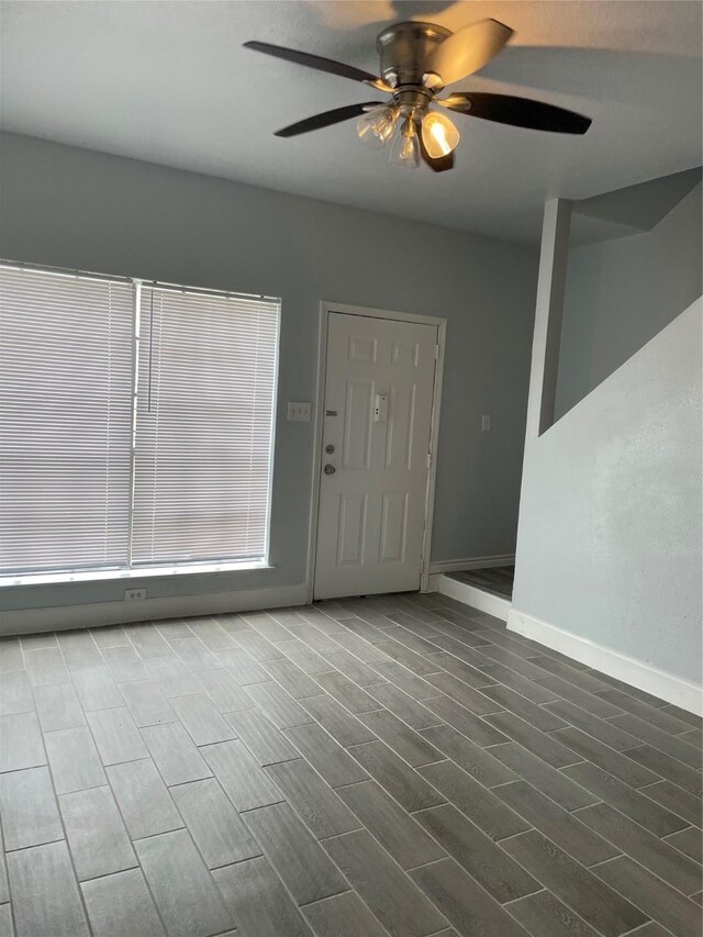 8703 Victorian Village Dr Unit 8703, Houston, TX 77071 - entryway featuring ceiling fan and dark wood-style flooring