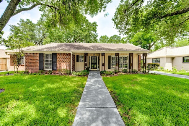 2602 Briarbrook Dr, Houston, TX 77042 - ranch-style house featuring a front yard and brick siding