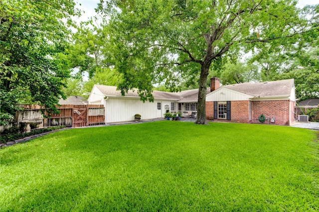 2602 Briarbrook Dr, Houston, TX 77042 - back of house with a chimney and brick siding
