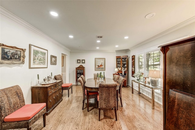 2602 Briarbrook Dr, Houston, TX 77042 - dining space with crown molding, light wood-style flooring, and recessed lighting