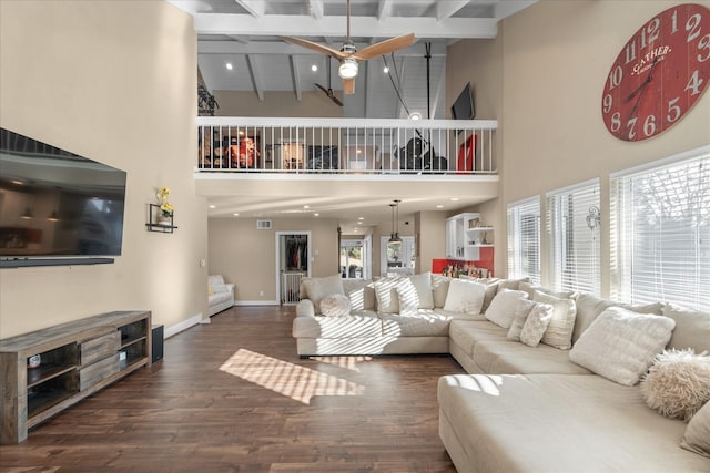 8307 Amber Cove Dr, Atascocita, TX 77346 - living area with a ceiling fan, wood finished floors, beam ceiling, and a high ceiling