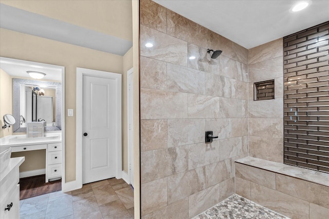 8307 Amber Cove Dr, Atascocita, TX 77346 - bathroom featuring tiled shower and vanity