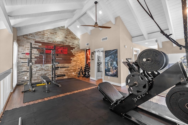 8307 Amber Cove Dr, Atascocita, TX 77346 - exercise room with high vaulted ceiling, ceiling fan, brick wall, and an accent wall