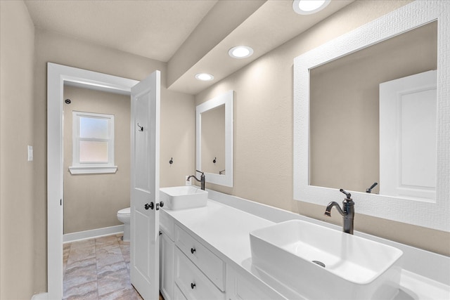 8307 Amber Cove Dr, Atascocita, TX 77346 - full bath with marble look tile flooring, double vanity, and recessed lighting