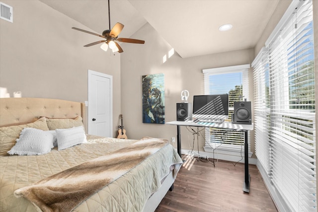 8307 Amber Cove Dr, Atascocita, TX 77346 - bedroom with wood finished floors, lofted ceiling, ceiling fan, and recessed lighting
