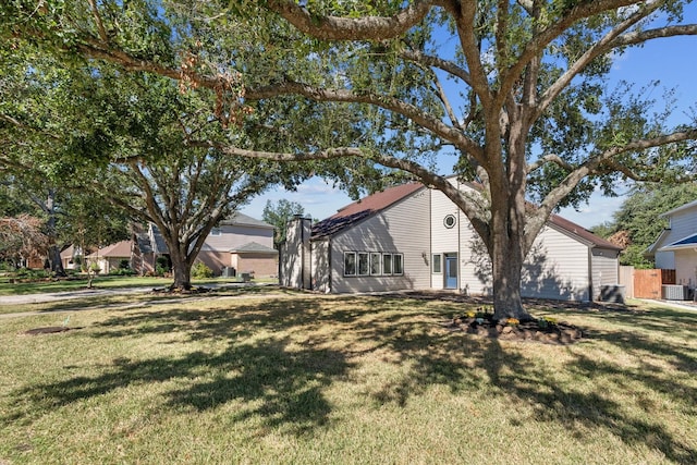 8307 Amber Cove Dr, Atascocita, TX 77346 - view of home's exterior featuring a yard and a central AC unit
