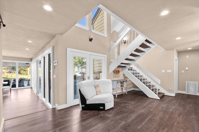 8307 Amber Cove Dr, Atascocita, TX 77346 - sitting room with french doors, wood finished floors, stairway, and recessed lighting