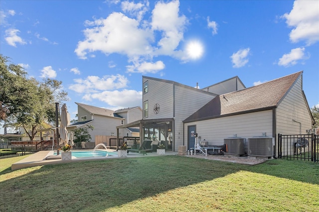 8307 Amber Cove Dr, Atascocita, TX 77346 - back of house featuring a fenced backyard, a patio area, and a shingled roof