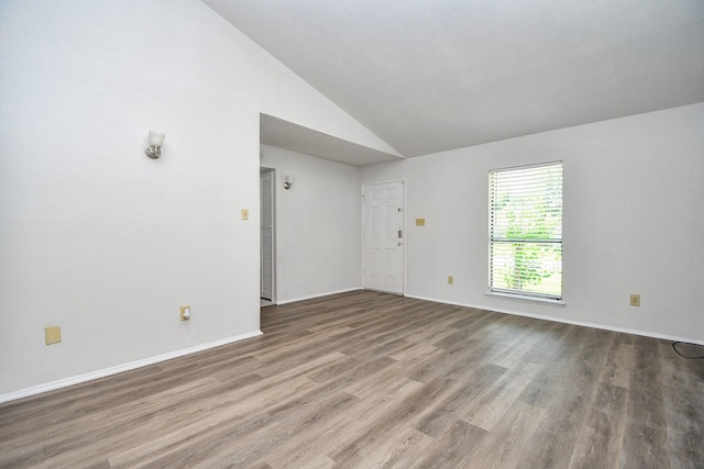 6915 Jeb Stuart Dr, Richmond, TX 77469 - unfurnished room with vaulted ceiling and wood finished floors