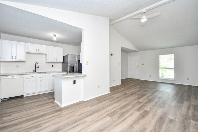 6915 Jeb Stuart Dr, Richmond, TX 77469 - kitchen featuring dishwasher, stainless steel fridge with ice dispenser, white cabinetry, light wood-type flooring, and open floor plan