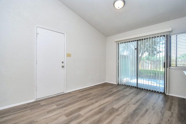 6915 Jeb Stuart Dr, Richmond, TX 77469 - spare room featuring wood finished floors and vaulted ceiling