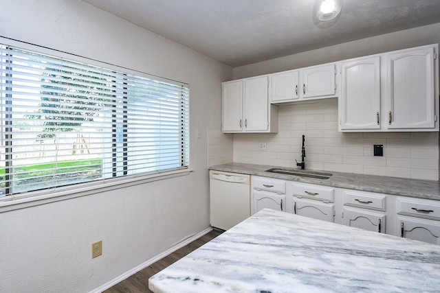 6915 Jeb Stuart Dr, Richmond, TX 77469 - kitchen with dishwasher, dark wood-style floors, backsplash, and white cabinets