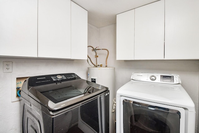 6915 Jeb Stuart Dr, Richmond, TX 77469 - laundry room featuring independent washer and dryer, cabinet space, and electric water heater