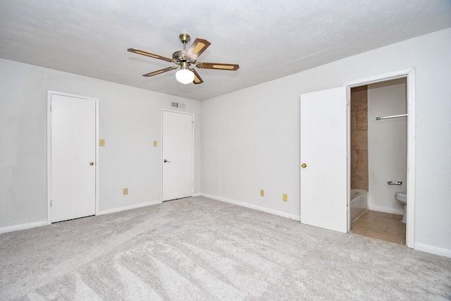 6915 Jeb Stuart Dr, Richmond, TX 77469 - unfurnished bedroom featuring carpet flooring, ensuite bath, and ceiling fan