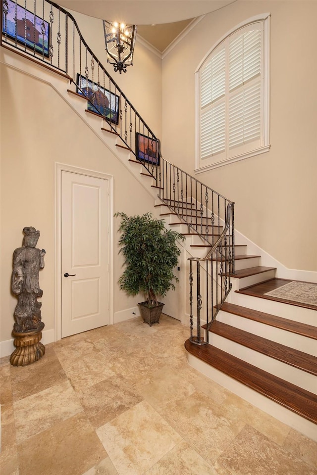 25 N Creekside Ct, Houston, TX 77055 - stairs with a high ceiling, crown molding, and a chandelier