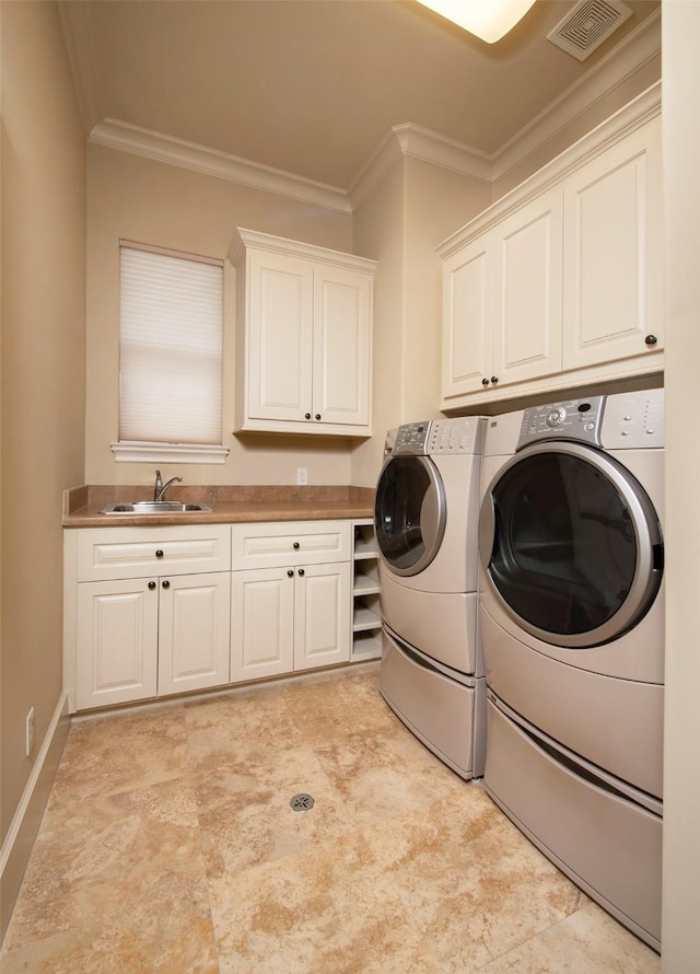 25 N Creekside Ct, Houston, TX 77055 - laundry room with cabinet space, washing machine and dryer, and ornamental molding