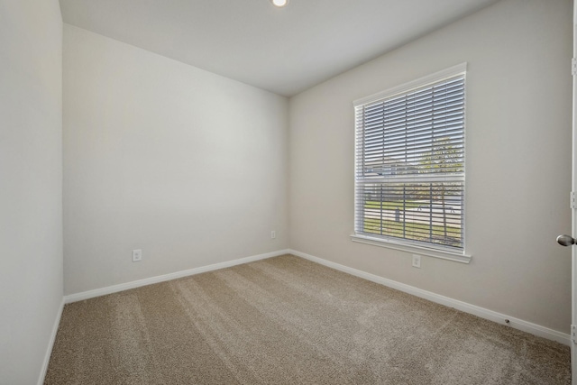 10419 Red Cardinal Dr, Houston, TX 77328 - spare room featuring carpet flooring and baseboards