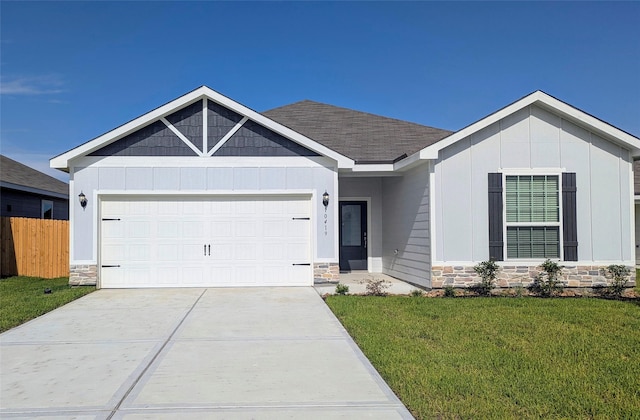 10419 Red Cardinal Dr, Houston, TX 77328 - view of front of property with stone siding, a garage, concrete driveway, and board and batten siding