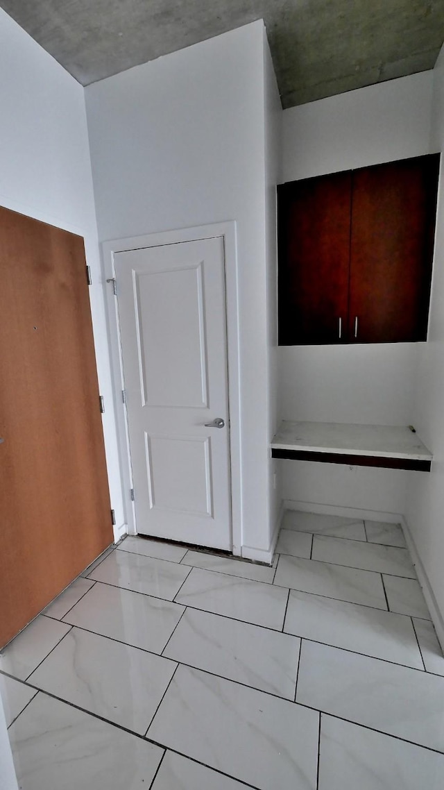 5925 Almeda Rd Unit 12113, Houston, TX 77004 - kitchen featuring light marble finish flooring and baseboards