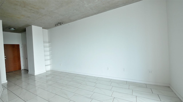 5925 Almeda Rd Unit 12113, Houston, TX 77004 - empty room with baseboards and light tile patterned floors