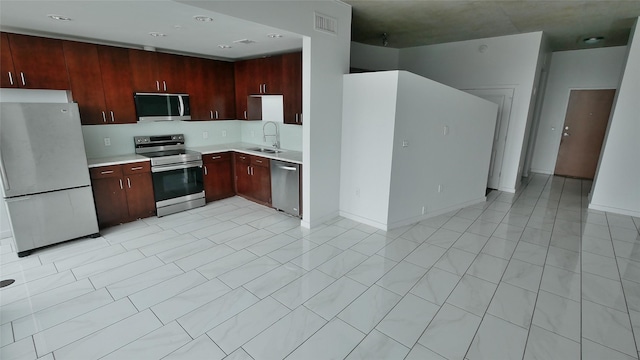 5925 Almeda Rd Unit 12113, Houston, TX 77004 - kitchen featuring stainless steel appliances, light countertops, and decorative backsplash