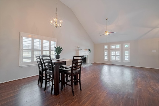 5814 N Magazine Cir, Houston, TX 77084 - dining space with ceiling fan, high vaulted ceiling, healthy amount of natural light, a chandelier, and dark wood-style floors