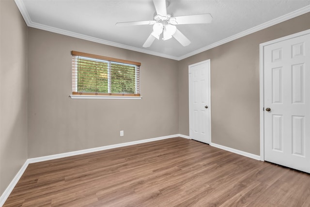 17427 Pinewood Forest Dr, Spring, TX 77379 - unfurnished bedroom with wood finished floors, crown molding, and ceiling fan