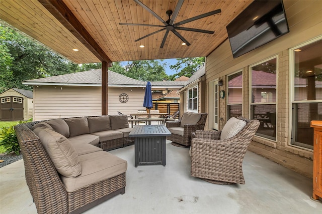 17427 Pinewood Forest Dr, Spring, TX 77379 - view of patio featuring an outdoor hangout area, a ceiling fan, and a storage unit