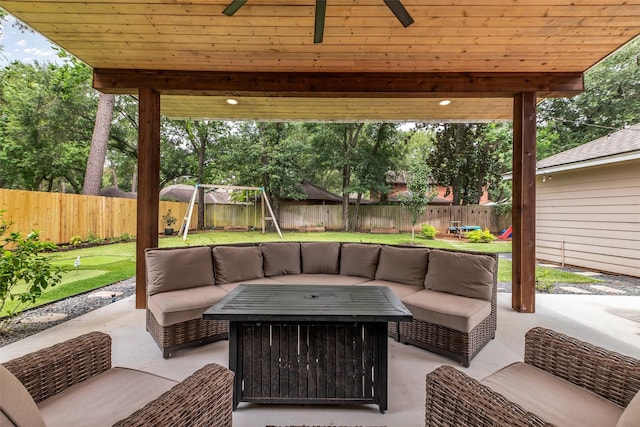 17427 Pinewood Forest Dr, Spring, TX 77379 - fenced backyard with an outdoor living space, a putting green, a patio, and ceiling fan
