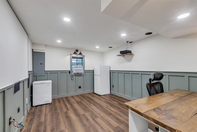 17427 Pinewood Forest Dr, Spring, TX 77379 - office space with a wainscoted wall, a decorative wall, dark wood-type flooring, electric panel, and recessed lighting