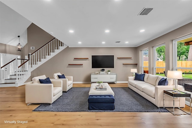 17427 Pinewood Forest Dr, Spring, TX 77379 - living room with wood finished floors, stairs, and recessed lighting