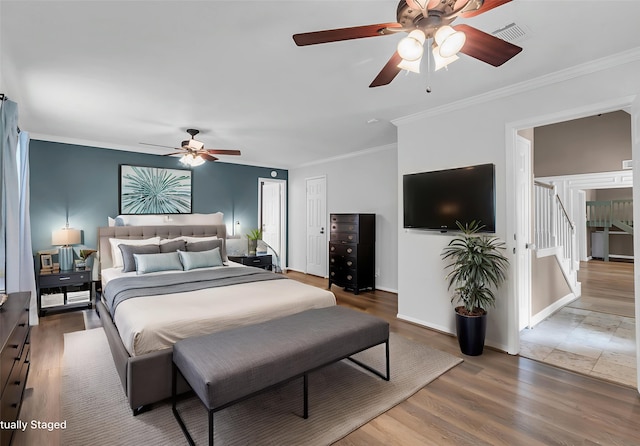 17427 Pinewood Forest Dr, Spring, TX 77379 - bedroom with ornamental molding, wood finished floors, and ceiling fan