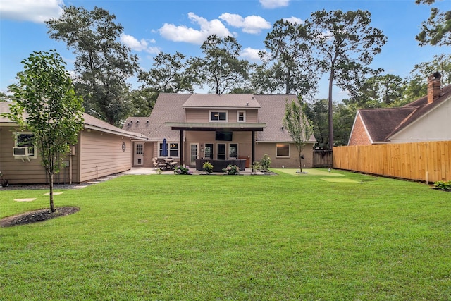 17427 Pinewood Forest Dr, Spring, TX 77379 - back of property featuring a patio area and a shingled roof