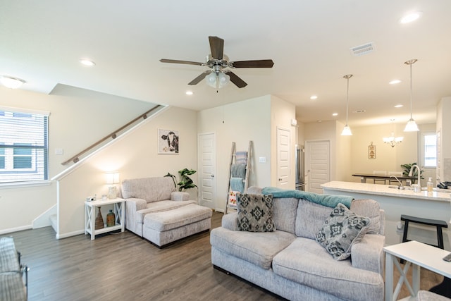5529 Evanston Ln, Pasadena, TX 77505 - living area featuring stairs, wood finished floors, a ceiling fan, and recessed lighting