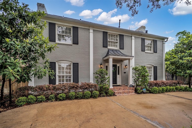 2539 Addison Rd, Houston, TX 77030 - view of front of house with a chimney and brick siding