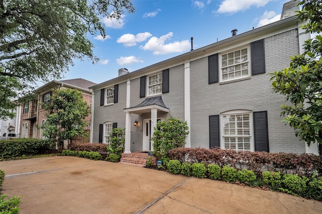 2539 Addison Rd, Houston, TX 77030 - view of front facade with brick siding and a chimney
