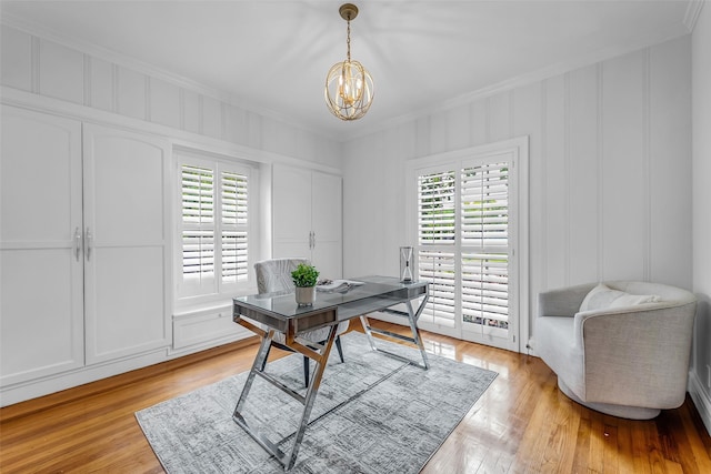 2539 Addison Rd, Houston, TX 77030 - office space featuring a decorative wall, ornamental molding, a chandelier, and light wood-style flooring