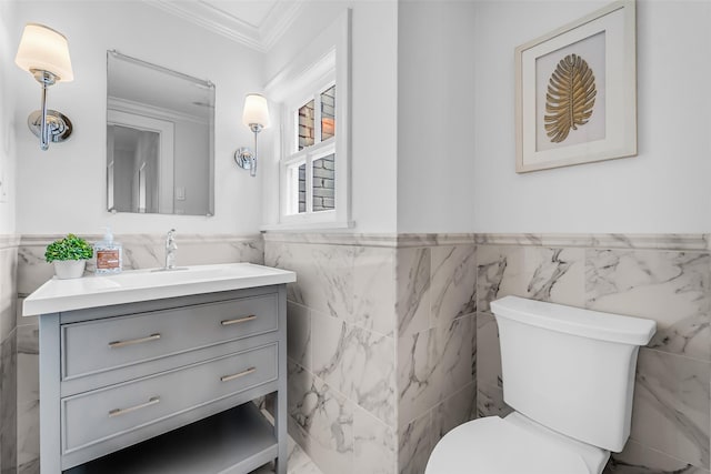 2539 Addison Rd, Houston, TX 77030 - bathroom with tile walls, a wainscoted wall, crown molding, and vanity