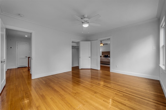 2539 Addison Rd, Houston, TX 77030 - unfurnished bedroom with light wood-type flooring, ornamental molding, a ceiling fan, and a closet